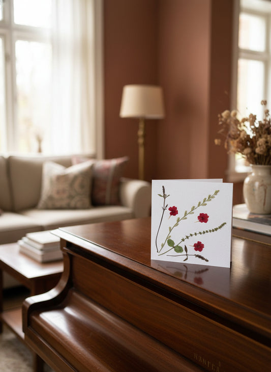 White card with red Verbena design on a light background