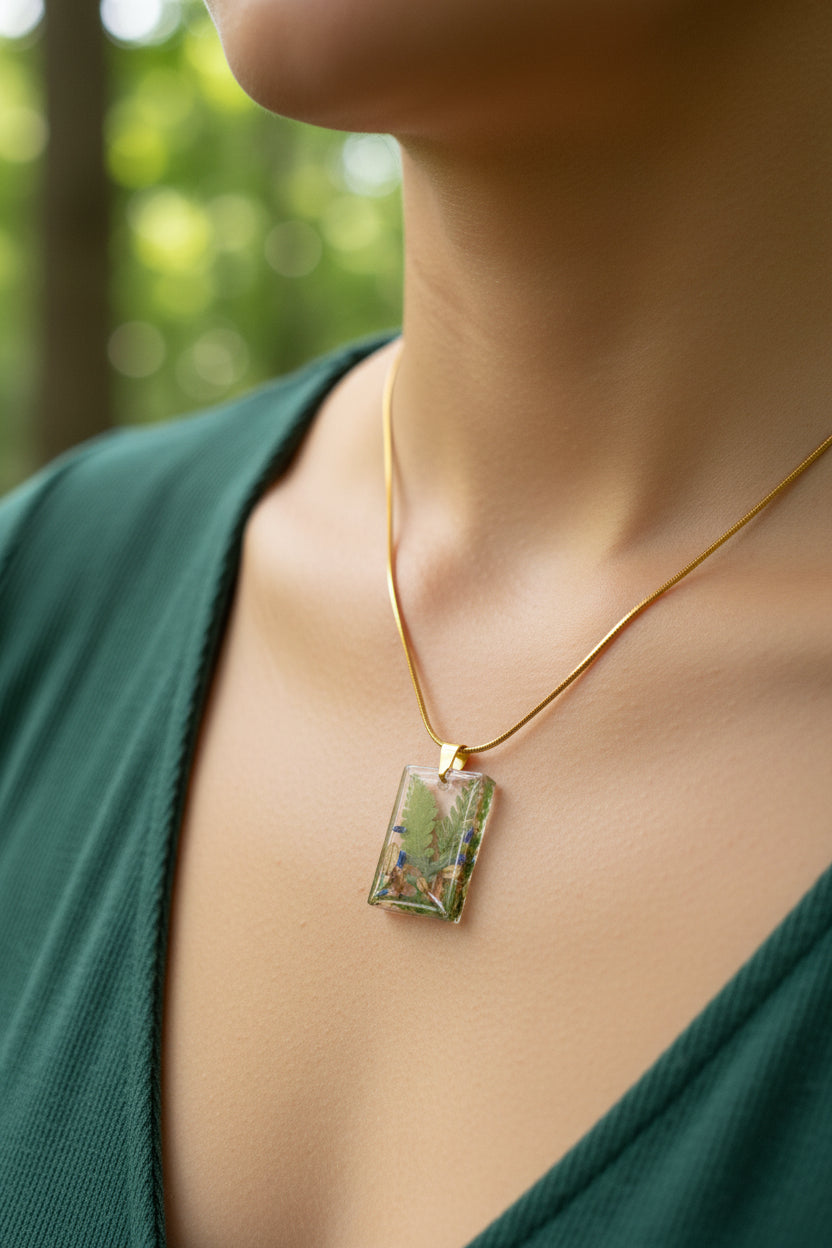 Necklace with a rectangular pendant containing real pressed ferns, mos, lavender.