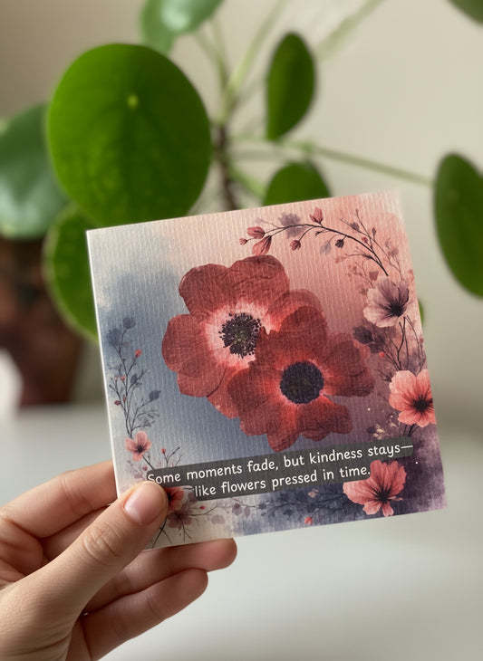 Floral card with red anemones and leaves on a light background